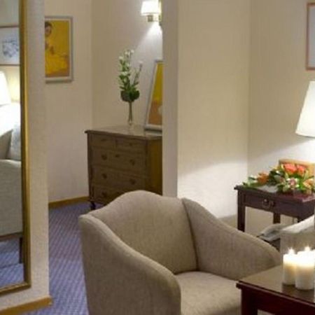 Corfu Palace Hotel Habitación foto A room at the hotel